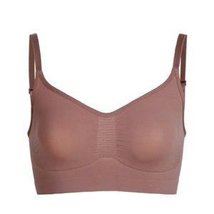 SKIMS , sculpting bralette in “Umber” . It’s sized L/XL